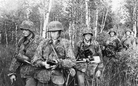 Soldiers Of The 1st Ss Panzer Division Lssah During The Attacks On The