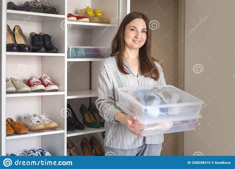 Portrait Beauty Brunette Woman Hold Plastic Box Shoes Storage Organization Posing At Wardrobe