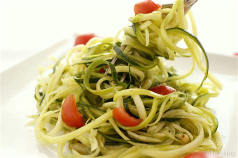 A dish that has spaghetti as a main part of it, such as spaghetti bolognese. Zucchini spaghetti with pesto and cherry tomatoes