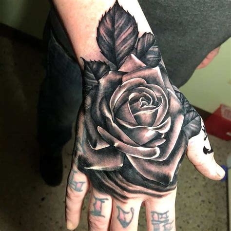 Rose Hand Tattoo Updated 35 Beautiful Black Rose Tattoo Designs