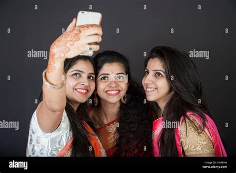 Three Young Indian Sisters Taking A Selfie At Mumbai Maharashtra India Three Happy Sisters Stock