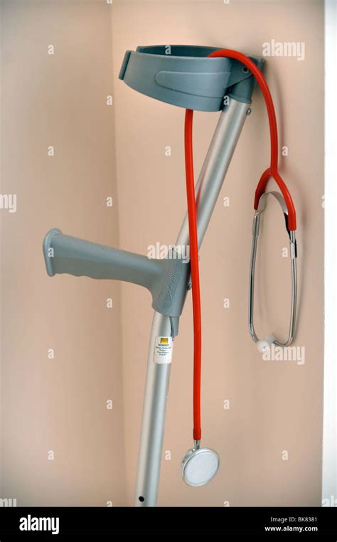 A Hospital Walking Crutch And A Doctors Stethoscope Stock Photo Alamy