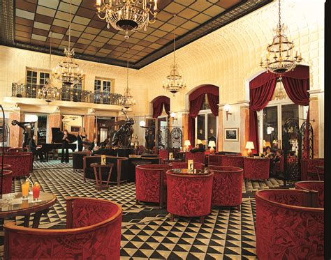 Art deco Interior Design with red seats and cool ceiling and floor at