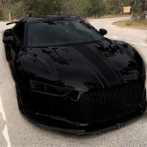 A Black Sports Car Is Parked On The Street