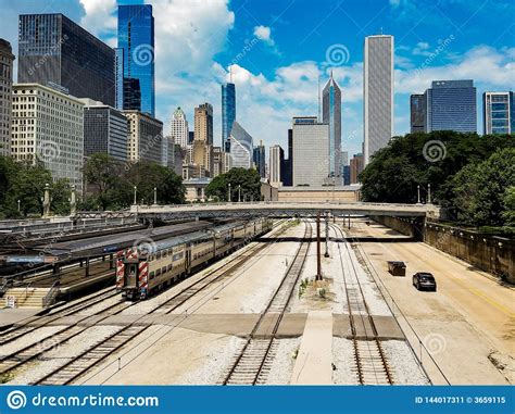 Landscape With Railroad Track And Chain Of Cargo Wagons Editorial Image