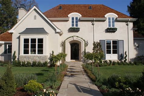 The legend of red house goes a long way back. white stucco house brown roof - Google Search | Exterior paint colors for house, Red roof house ...