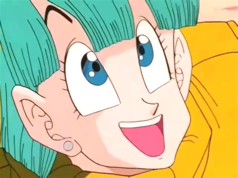 A Close Up Of A Person With Green Hair And Blue Eyes Smiling At The Camera