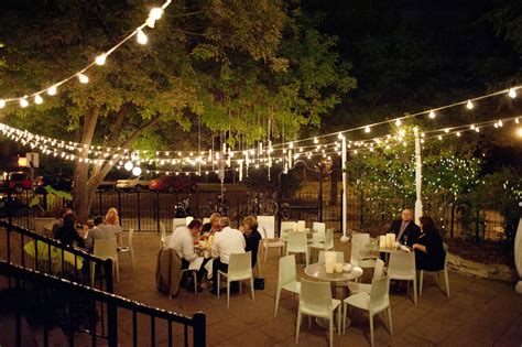 The Outdoor Nighttime Reception With String Lights At Cafe And Bar Lurcat