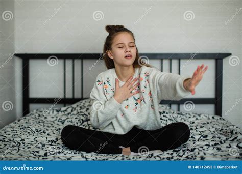 Twelve Year Old Cute Girl Having Fun In Her Room Sitting On Bed Royalty