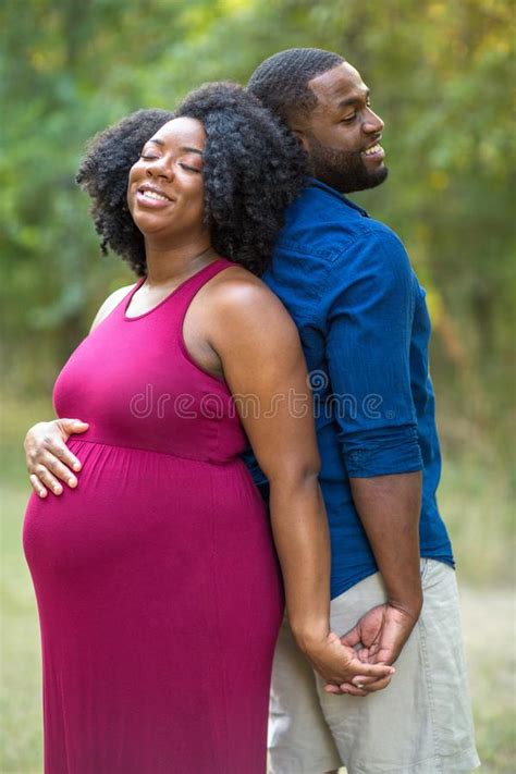 Portrait Of A Happy Pregnant African American Couple Stock Photo