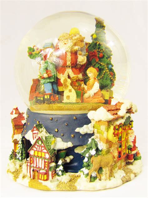 Then explore the winter wonderland where you'll become captivated by whimsical trees, a ballerina in a snow globe, and much more. Santa Claus and Children Snow Globe Music Box | Snow ...