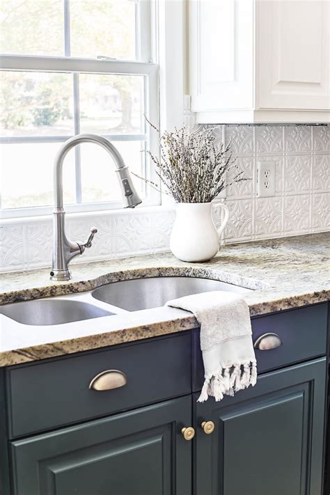 Sage green entryway paint is flooded up and over crown moulding and the ceiling to create clear zoning. Pin on brick backsplash kitchen
