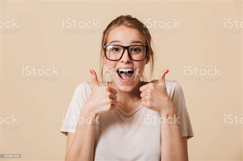 Photo Of Excited Woman 20s With Blonde Tied Hair Wearing Basic Tshirt