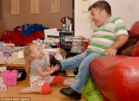 Heartwarming Pictures Show Unique Bond Between Dwarf Father And His