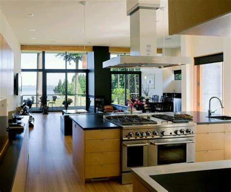 The black accent wall enhances the beautiful wood. New home designs latest.: Modern kitchen designs ideas.