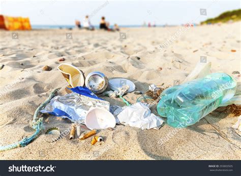 Garbage On A Beach Left By Tourist At Sunset Environmental Pollution