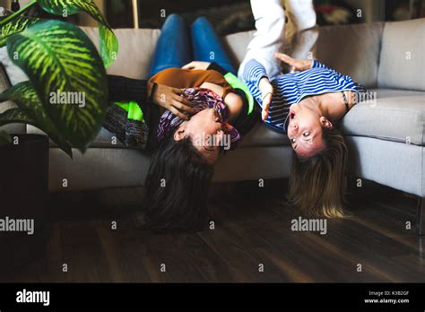 Two Womans Sitting On The Couch Take Some Good Time At Home Stock Photo