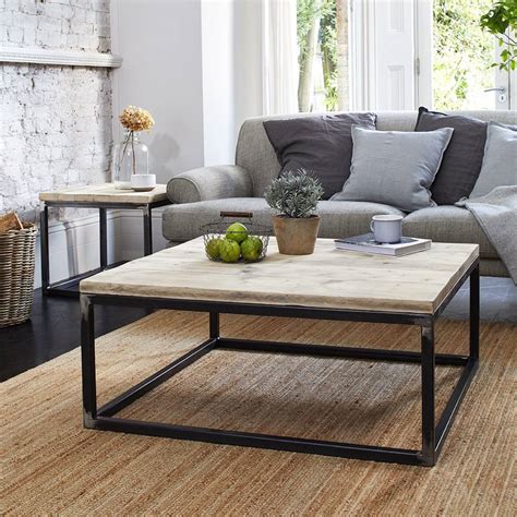 The coffee table has a rustic and natural style; Reclaimed Wood Coffee Table With Raw Steel Box Frame By ...