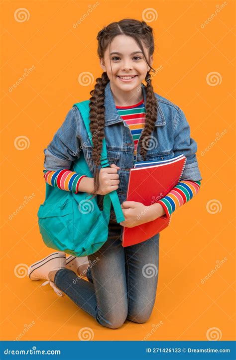 Happy Teen Girl Kneeling Yellow Background School Education In School