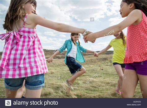 Girls Playing Ring Around The Rosy Stock Photo Alamy