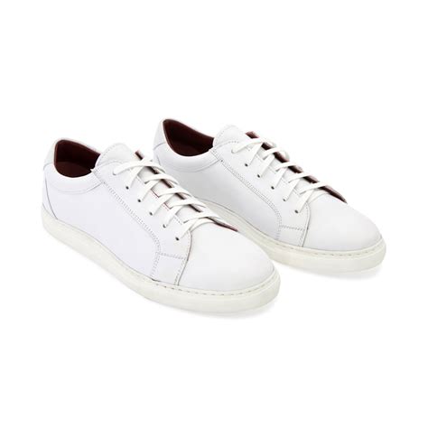 White residue on leather shoes. White leather Sneakers for men and women