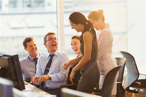Laughing Business People At Computer In Office Stock Image F016