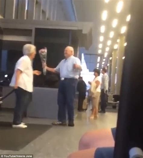 old man filmed surprising his wife with flowers at airport has gone viral on facebook daily