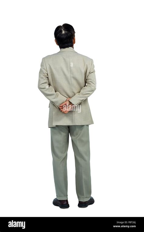 Businessman Standing And Looking With Hands Behind Back Stock Photo Alamy