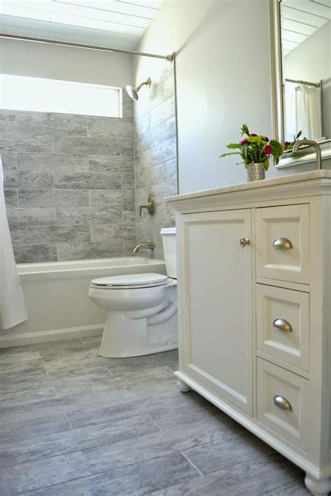 This tiny bathroom is made to feel much larger by the inclusion of mirror all around gray small bathroom decorating photo. How I Renovated Our Bathroom On A Budget