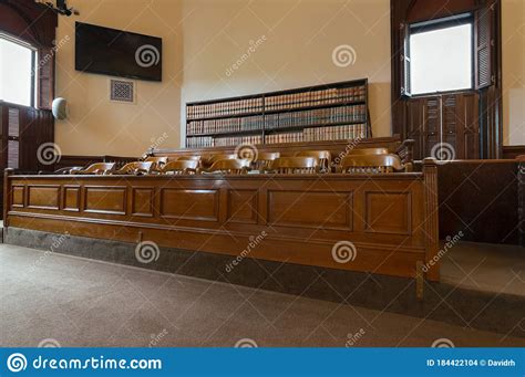 Light From Open Windows Falls On The Jury Box In A Courtroom In The