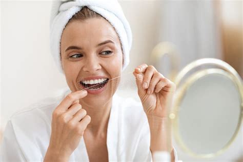 Adult Woman Using Dental Floss Cleaning Her Beautiful White Teeth