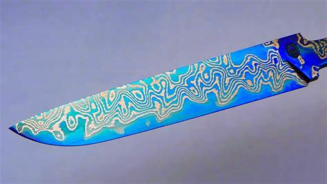 Metalsmith Turns Steel Mesh Into A Beautiful Blue Damascus Blade