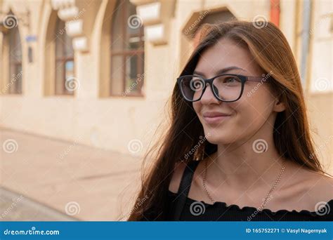 Close Up Portrait Of Beautiful Young Brunette Girl In Glasses With