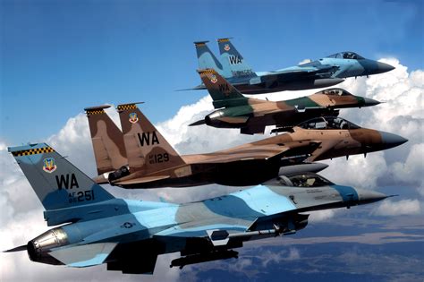 Stock Photo of Military Planes Flying in the Clouds
