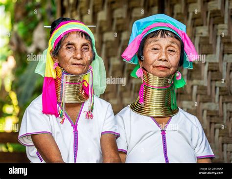 Two Padaung Women In Traditional Dress And With Metal Rings Around