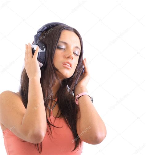Radiant Young Woman Listen To Music Wearing Headphones Isolated Over