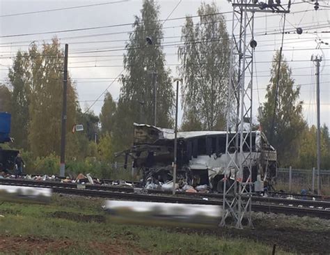 russia train crash horror pics as 19 die after bus torn apart on railway line daily star