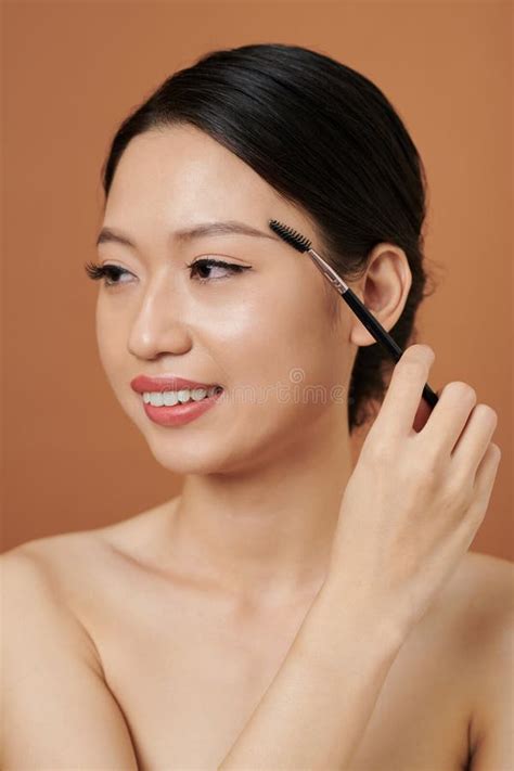 Young Woman Brushing Eyebrows Stock Image Image Of Female Woman