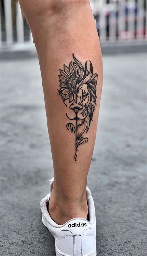 A Womans Leg With A Flower Tattoo On The Lower Part Of Her Leg