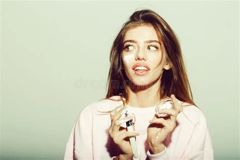 Surprised Pretty Girl Putting Facial Cream Or Mask On Face Stock Image Image Of Skin Facial