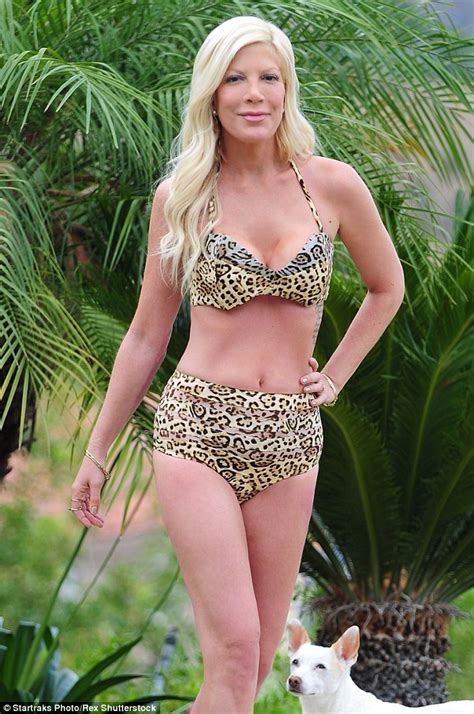 Tori Spelling In Cheetah Bikini As She Poses By Pool Of Her Calabasas