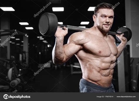 Brutal Strong Bodybuilder Athletic Men Pumping Up Muscles With D