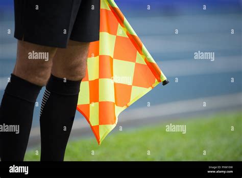 Assistant referee hold flag Stock Photo - Alamy
