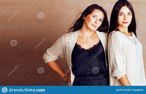Cute Pretty Teen Daughter With Mature Mother Hugging Fashion Style Brunette Makeup Close Up
