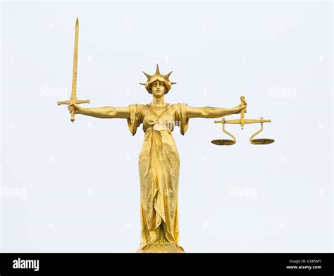 The Gold Bronze Lady Justice Statue With Sword And Scales Above The