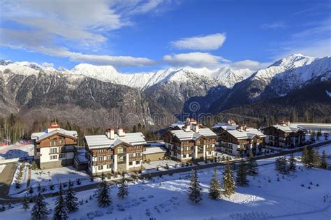 Snow Covered Cottages At The Mountain Ski Resort With Snow In Winter