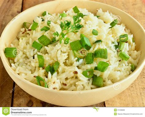 Add chicken cubes and remaining margarine and garlic powder. Rice with green onion stock photo. Image of cooked ...