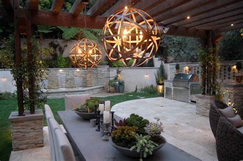 The Winns Modern Chandeliers Illuminate The Outdoor Dining Area Outdoor Hardscapes