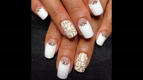 La decoración de uñas negras es un clásico en el mundo del nail art, que. Uñas decoradas blancas con dorado - YouTube