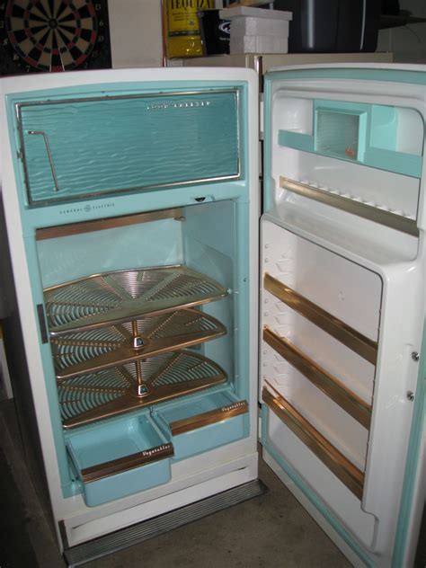 An Open Refrigerator With The Door Wide Open
